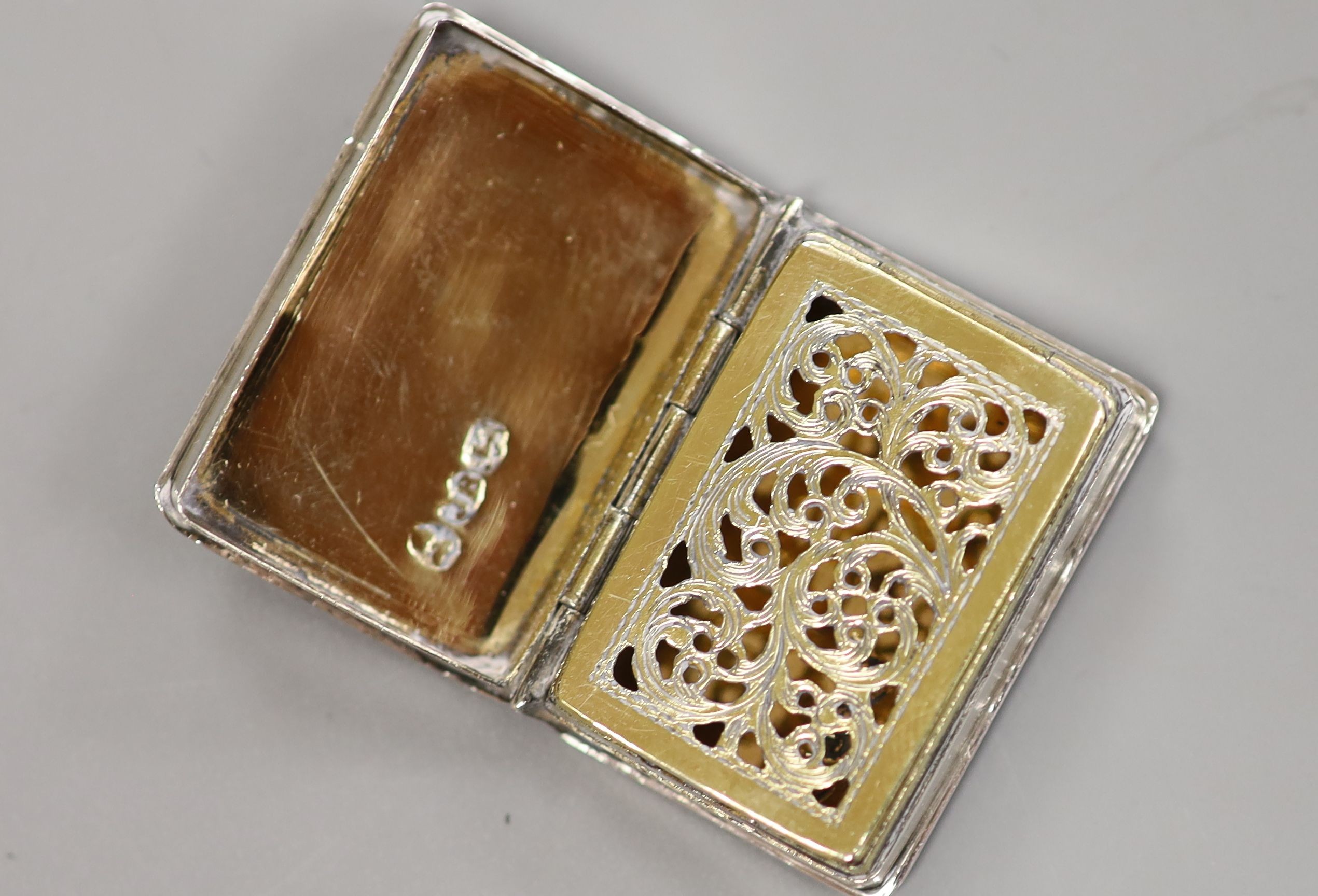 A William IV engraved silver vinaigrette, modelled as a book, Joseph Bettridge, Birmingham,1830, 31mm.
